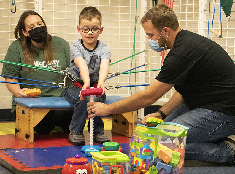 Patient with physical therapists