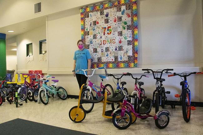 Girl Scout with donated bikes